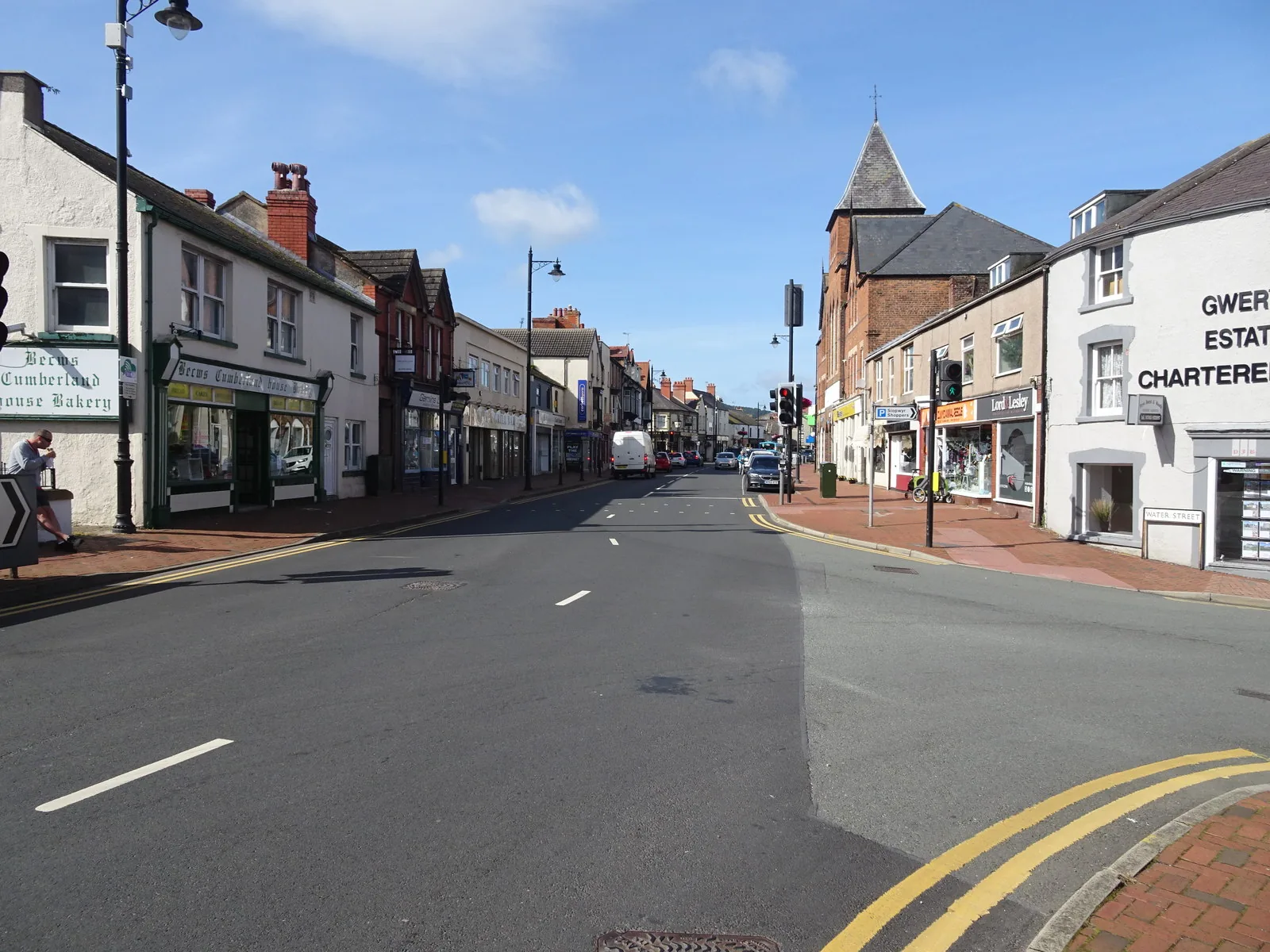 Shops and awnings along Market Street, Abergele, the road running east through the town centre