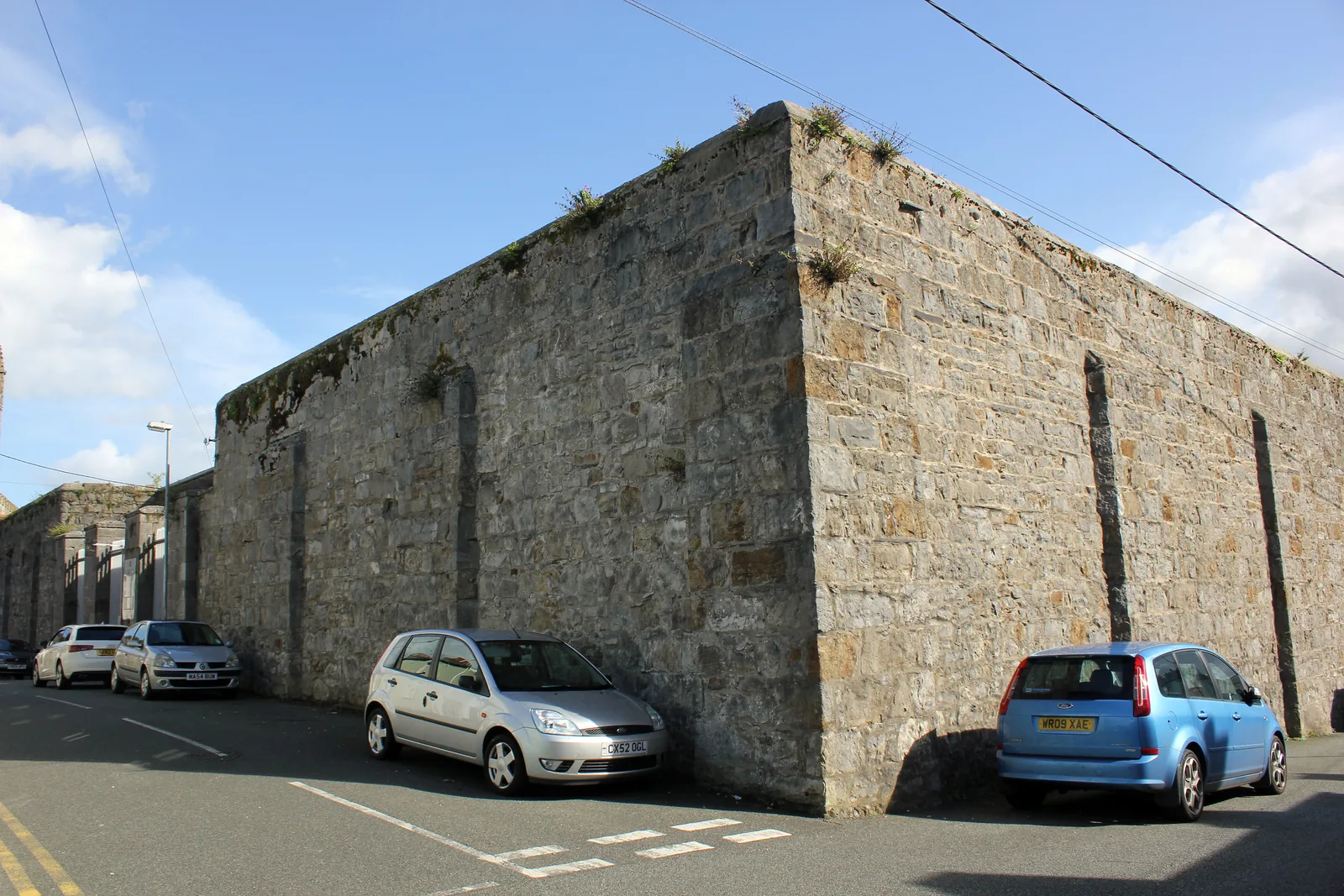 The stone perimeter wall and corner of Beaumaris Gaol on Steeple Lane