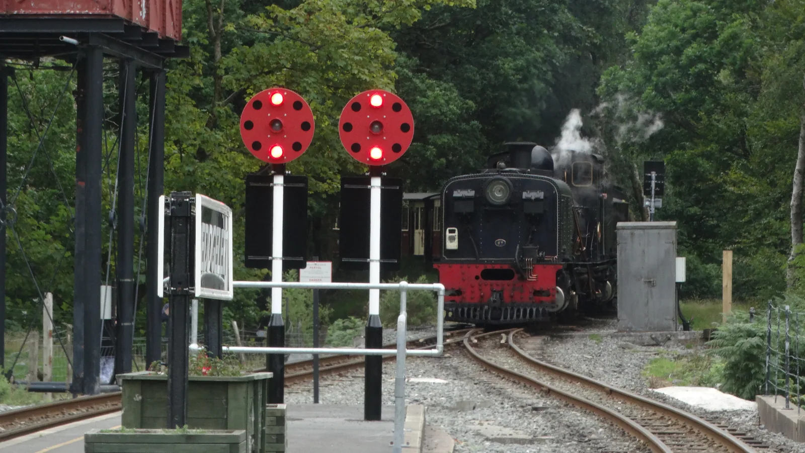 A steam train arriving at Beddgelert station on the Welsh Highland Railway