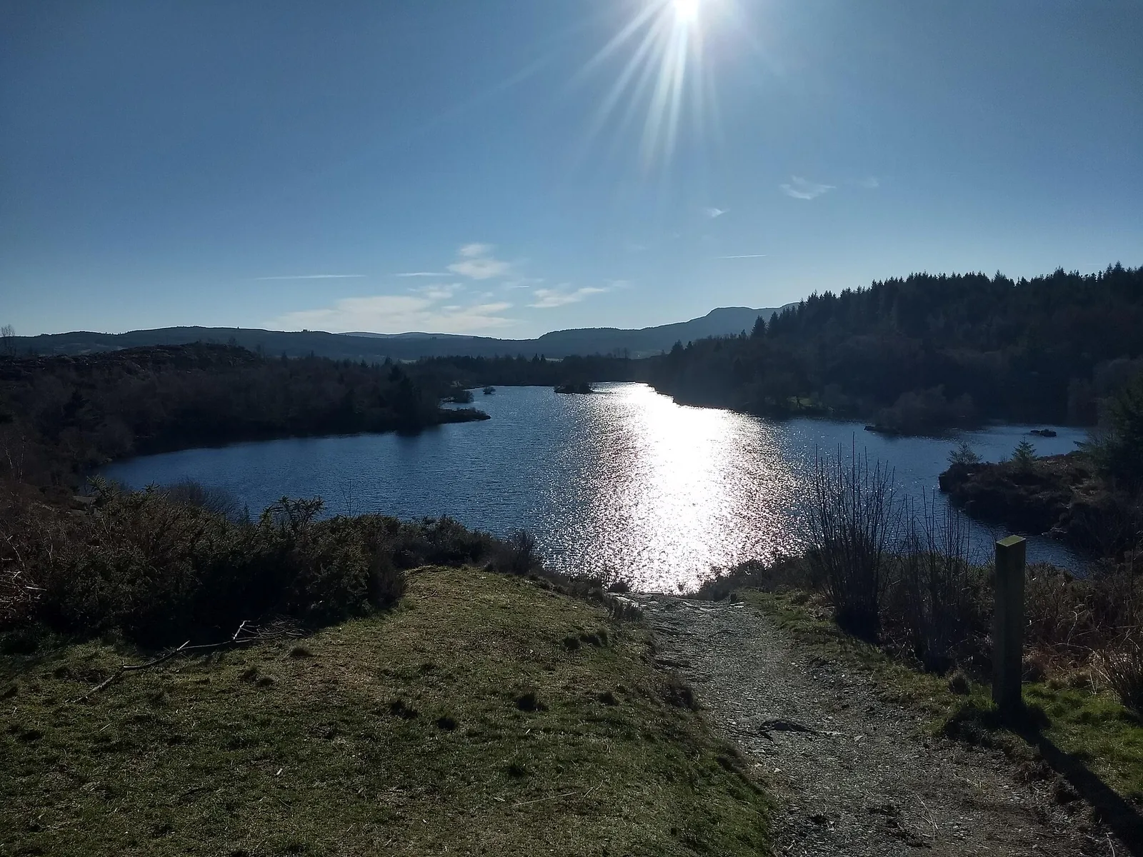 Llyn Elsi in the hills above Betws-y-Coed, with a forest path leading to the water