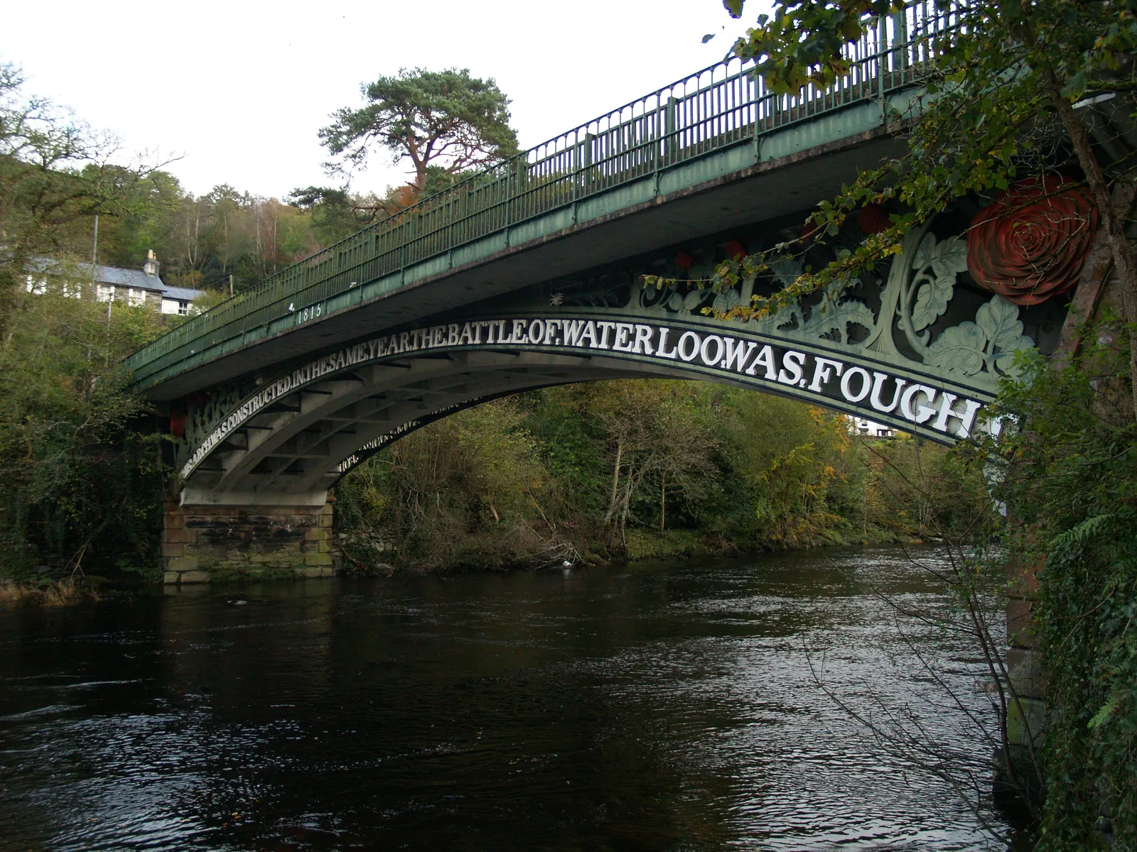Telford&rsquo;s cast-iron Waterloo Bridge over the Afon Conwy, the cast inscription running along the arch