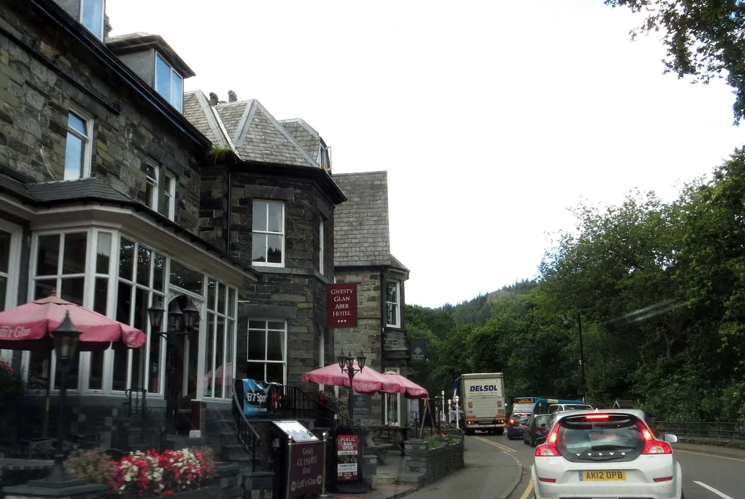 A hotel frontage with pavement tables on Holyhead Road, Betws-y-Coed