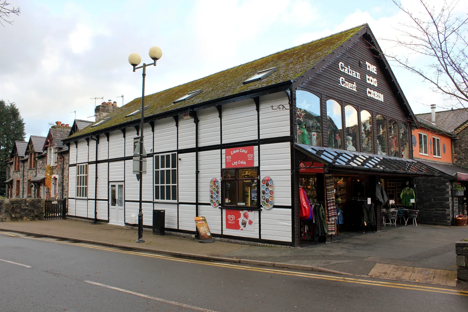 Caban Coed, a long timber-framed shop building beside the road in Betws-y-Coed