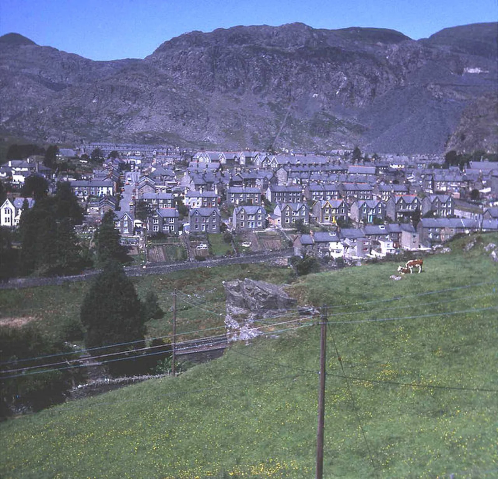 Blaenau Ffestiniog filling its valley beneath the quarried hillside, terraced streets and mountains beyond