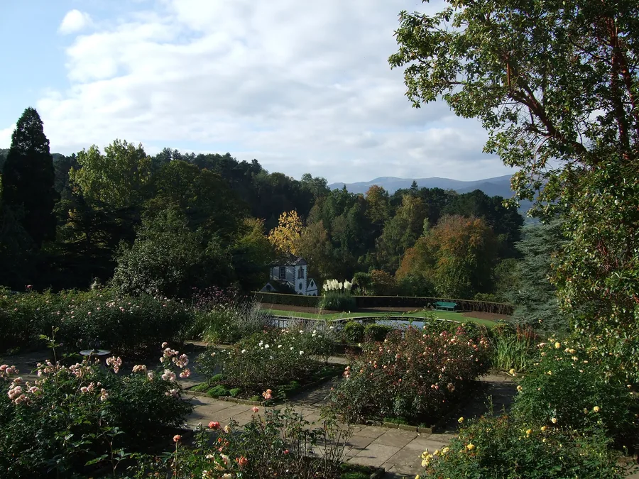 Above the Rose Terrace at Bodnant Garden, looking out over the formal garden to the hills beyond.