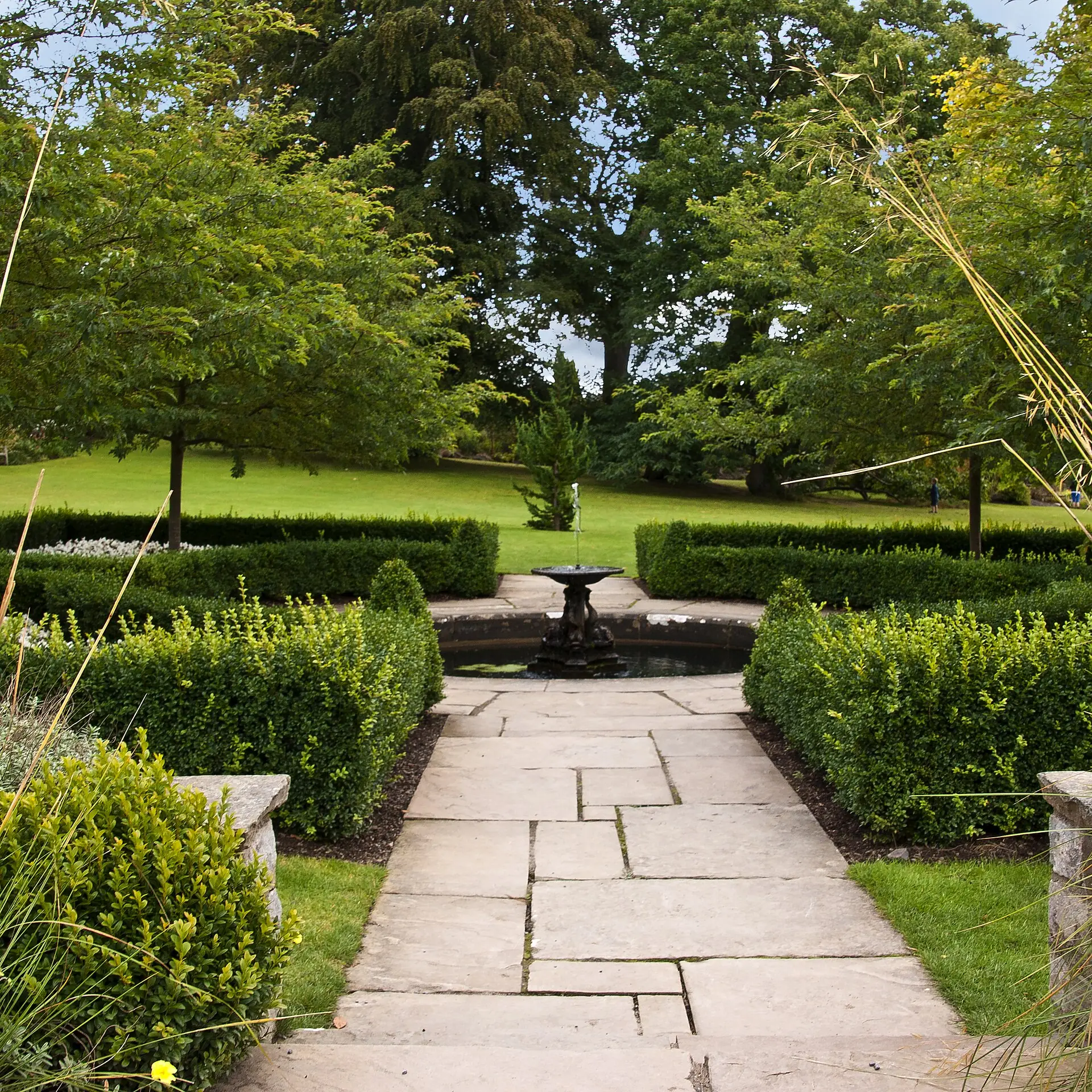 Above the Rose Terrace at Bodnant Garden, looking out over the formal garden to the hills of the Conwy valley beyond.