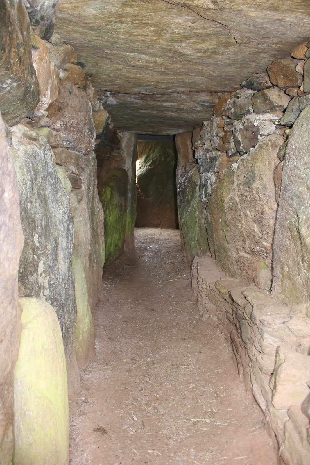 The stone burial chamber inside Bryn Celli Ddu, with its free-standing smooth pillar.