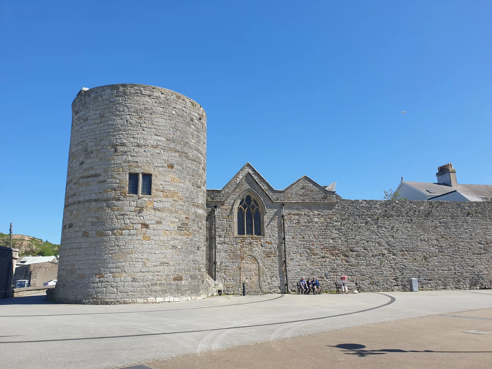 St Mary's Church, Caernarfon, its gable set against the round north-west tower of the town wall