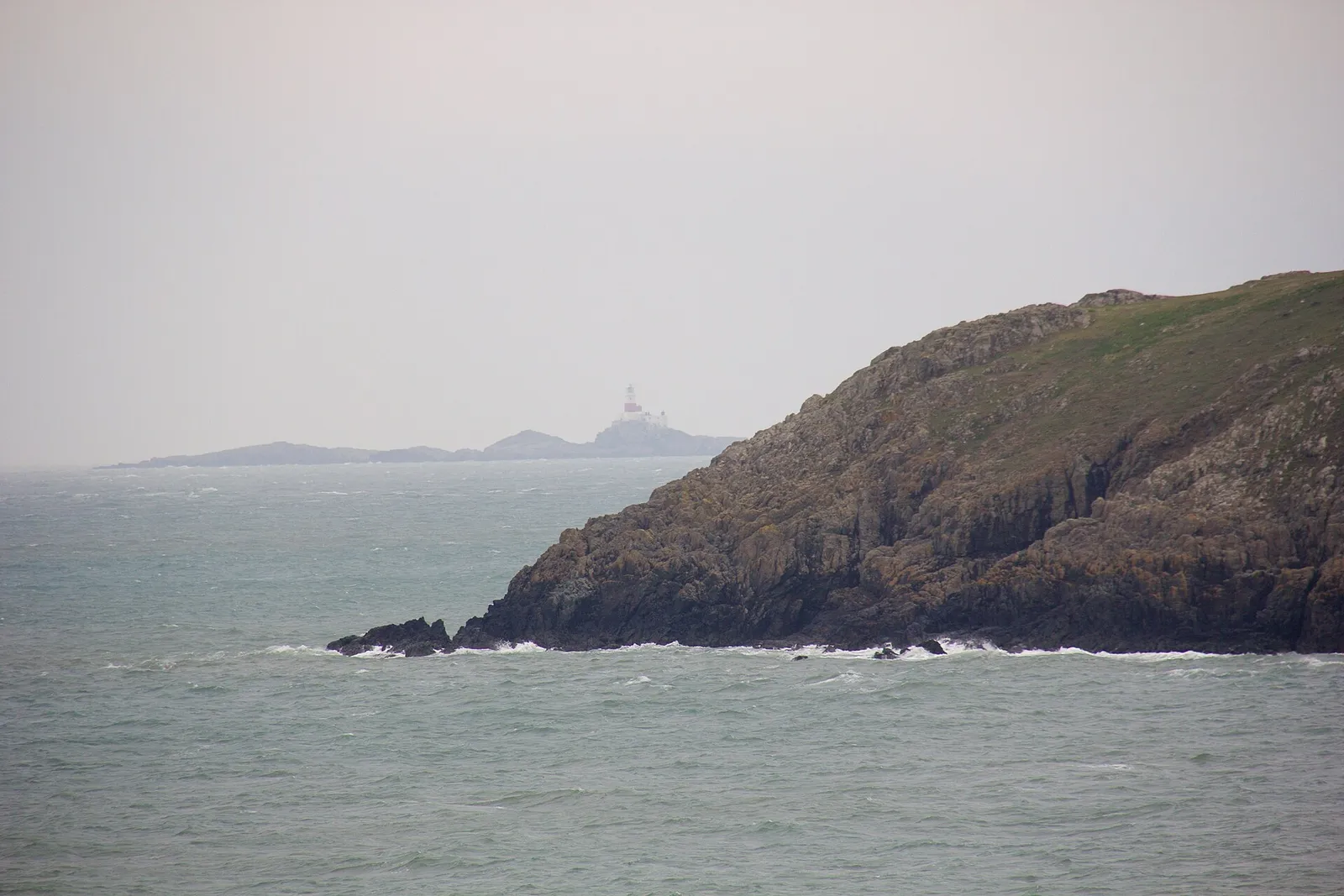 Looking south from Church Bay: coast path cliffs and the open Irish Sea toward Holyhead