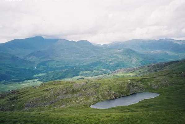 Llyn y Biswail, a small moorland lake below the summit ridge of Cnicht