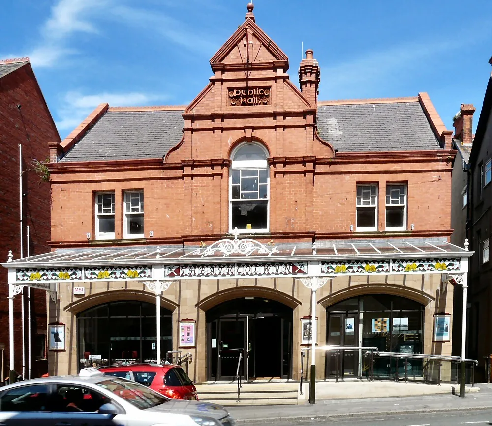 The red-brick frontage of Theatr Colwyn on Abergele Road, its canopy over the pavement