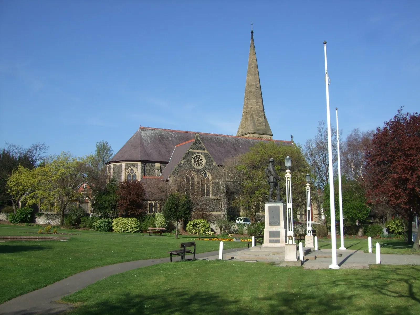 St John's Uniting Church and the war memorial standing in a public garden at Colwyn Bay