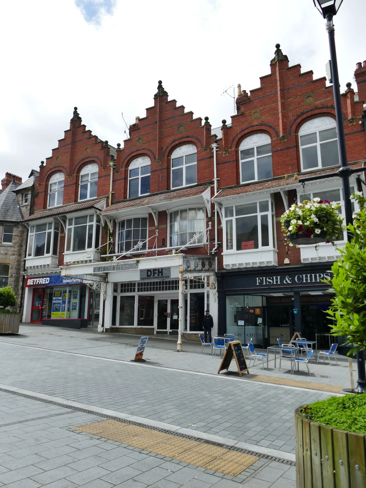 Red-brick Victorian shopfronts on Station Road, Colwyn Bay