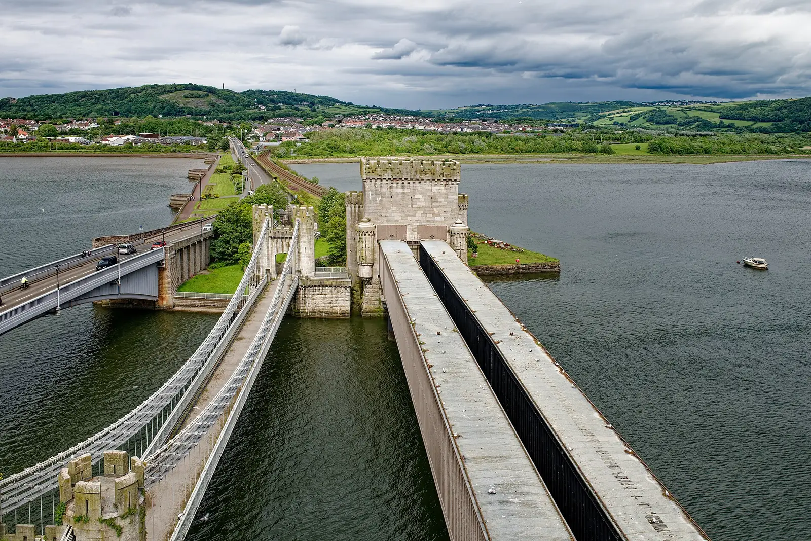 Conwy's suspension bridge and tubular railway bridge crossing the river side by side