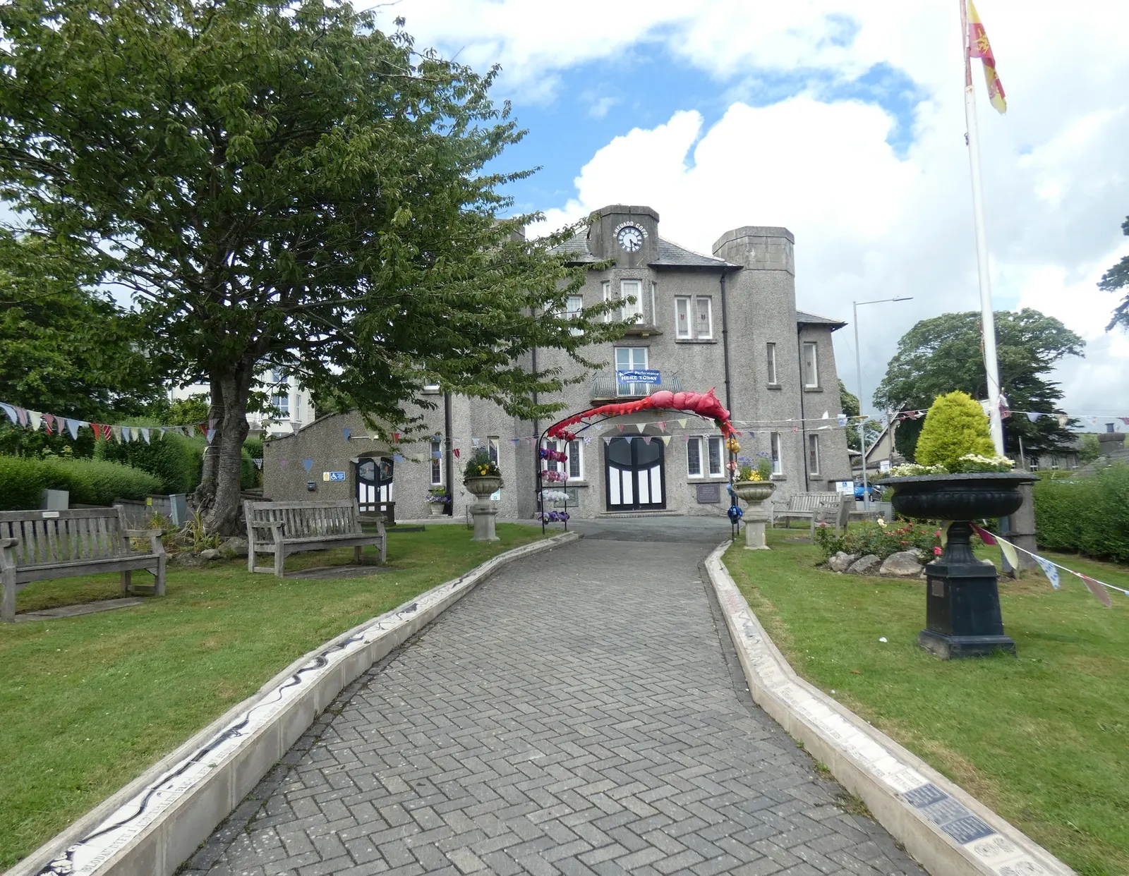 The Memorial Hall across the open green of Y Maes, Criccieth