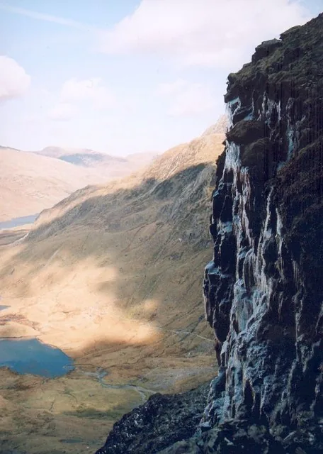 The dark, ice-streaked rock buttress near Twll Du, the Devil's Kitchen, rising above Cwm Idwal.