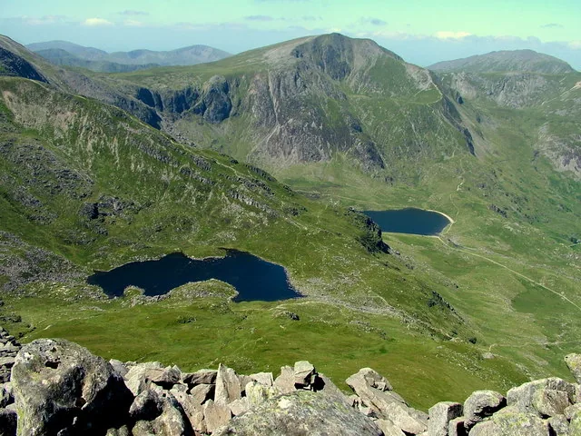 Y Garn and the Glyderau seen from above, with Llyn Idwal and a neighbouring lake small in the valley below.