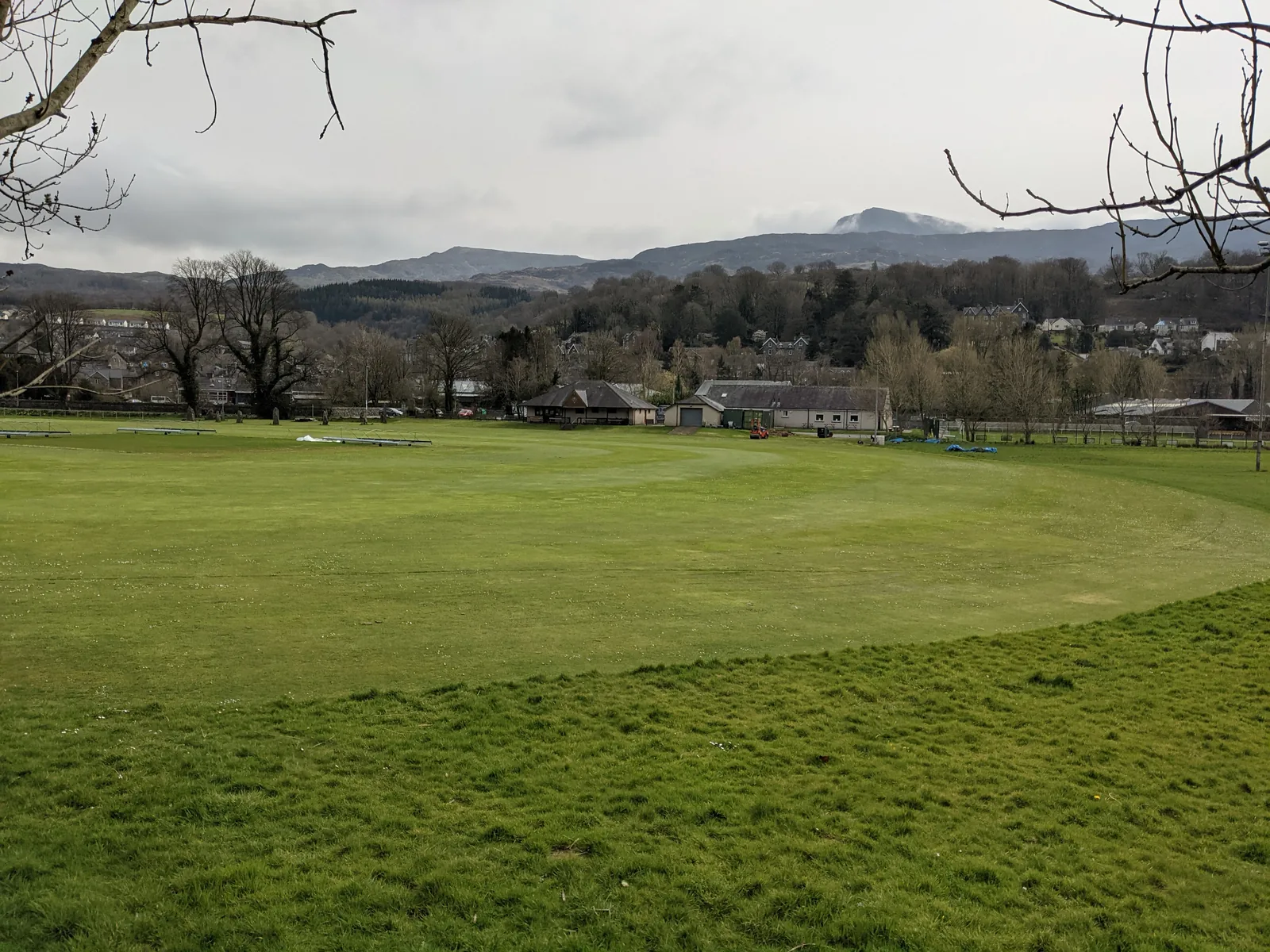 Open green space at the edge of Dolgellau, with the town and hills beyond