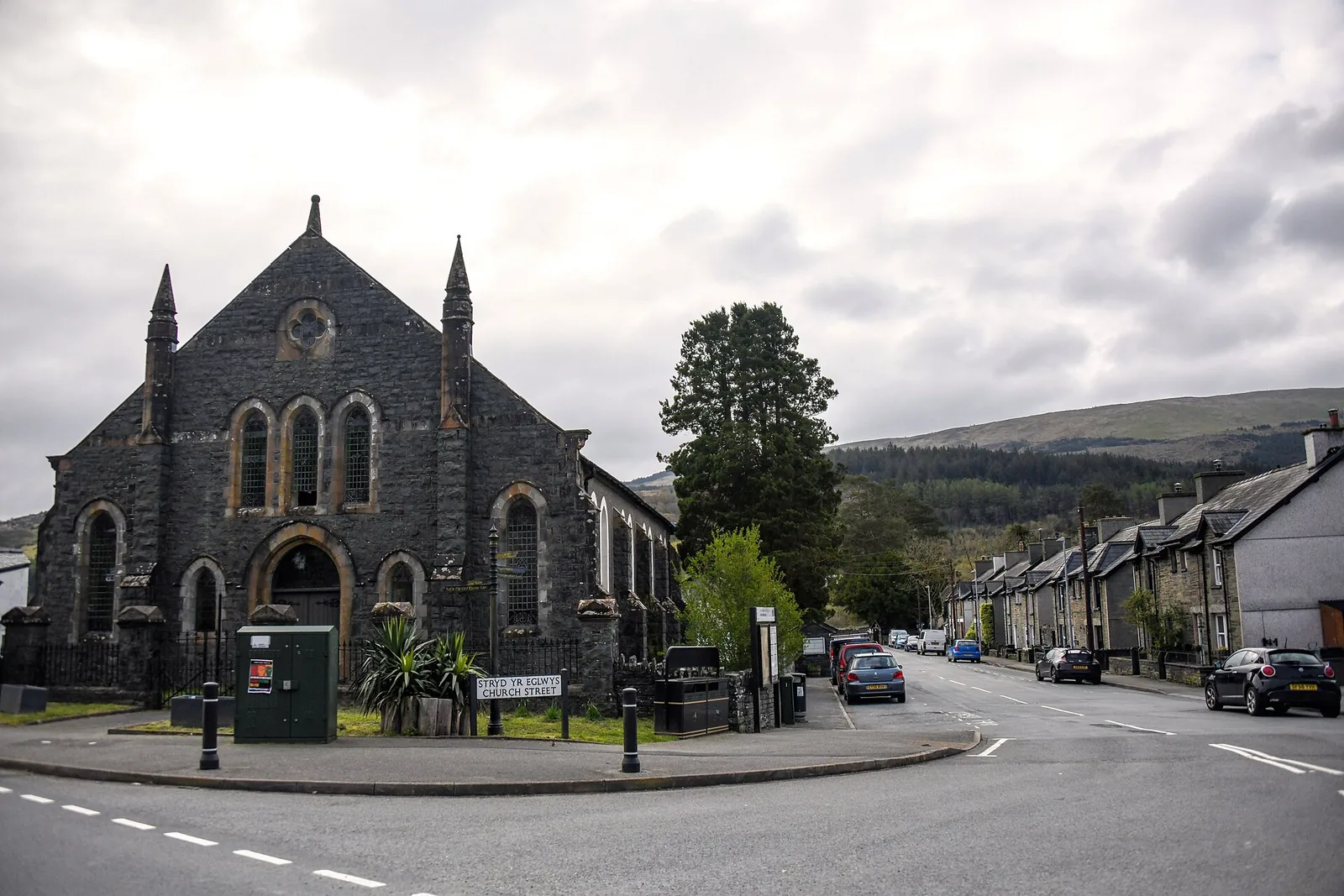 Church Street at Dolwyddelan, the tall gabled front of Capel Moreia on the corner and slate terraces running away up the road