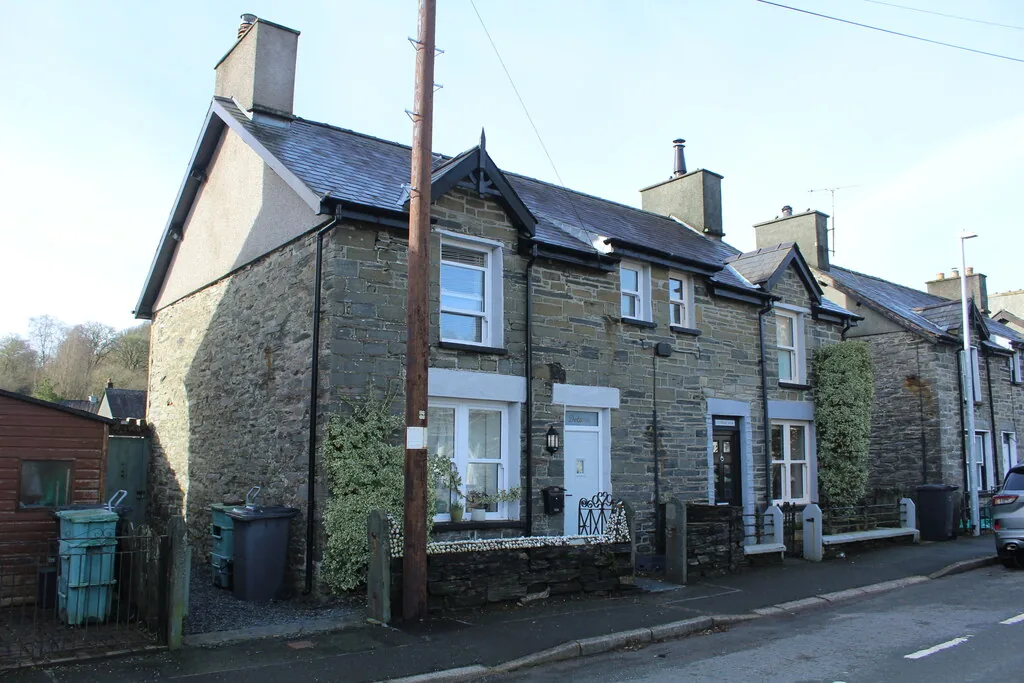 Terraced houses on Church Street at Dolwyddelan, slate fronts and chimneys along the pavement