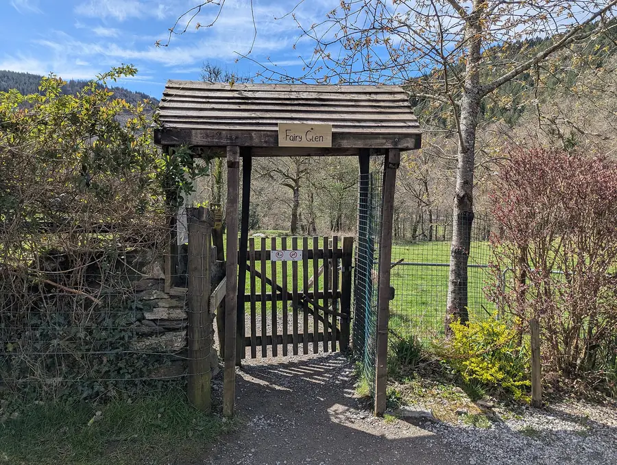 The wooden Fairy Glen gate marking the entrance to the gorge near Betws-y-Coed.