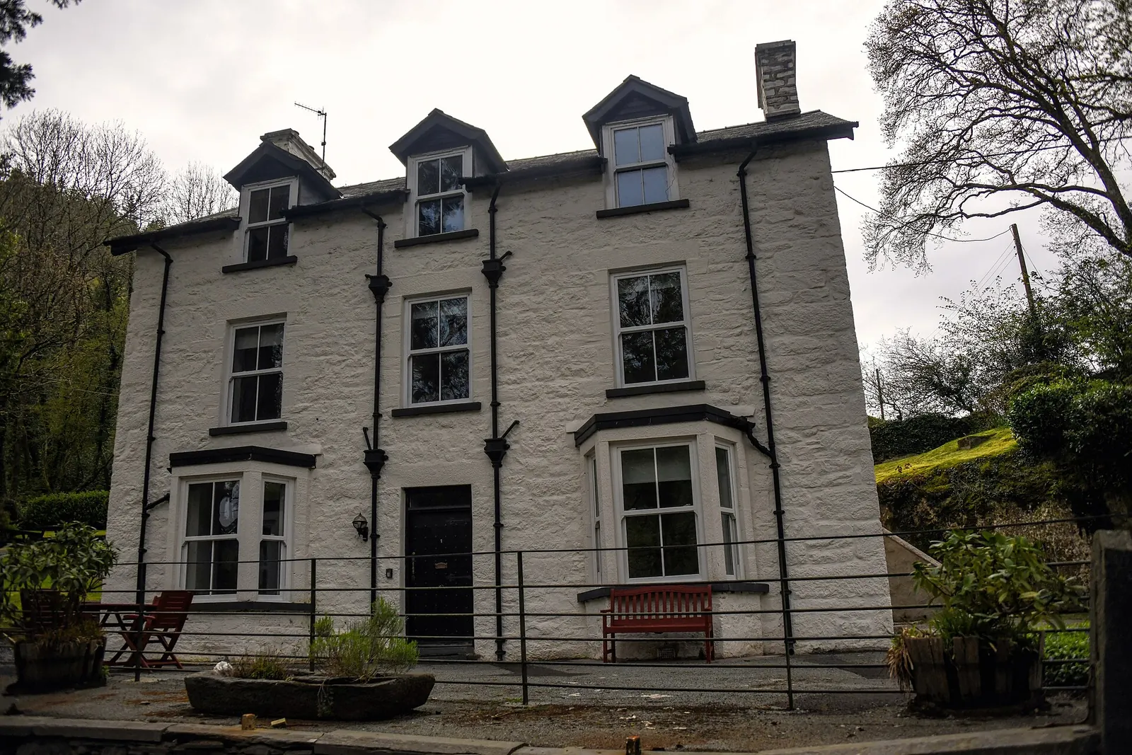 The Fairy Glen Hotel, a whitewashed Georgian building on the A470 beside the gorge entrance.