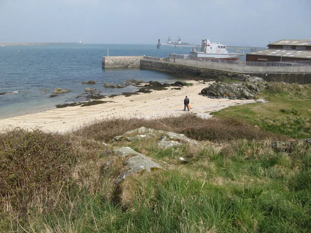 The boatyard at Newry Beach, Holyhead, boats drawn up beside the harbour