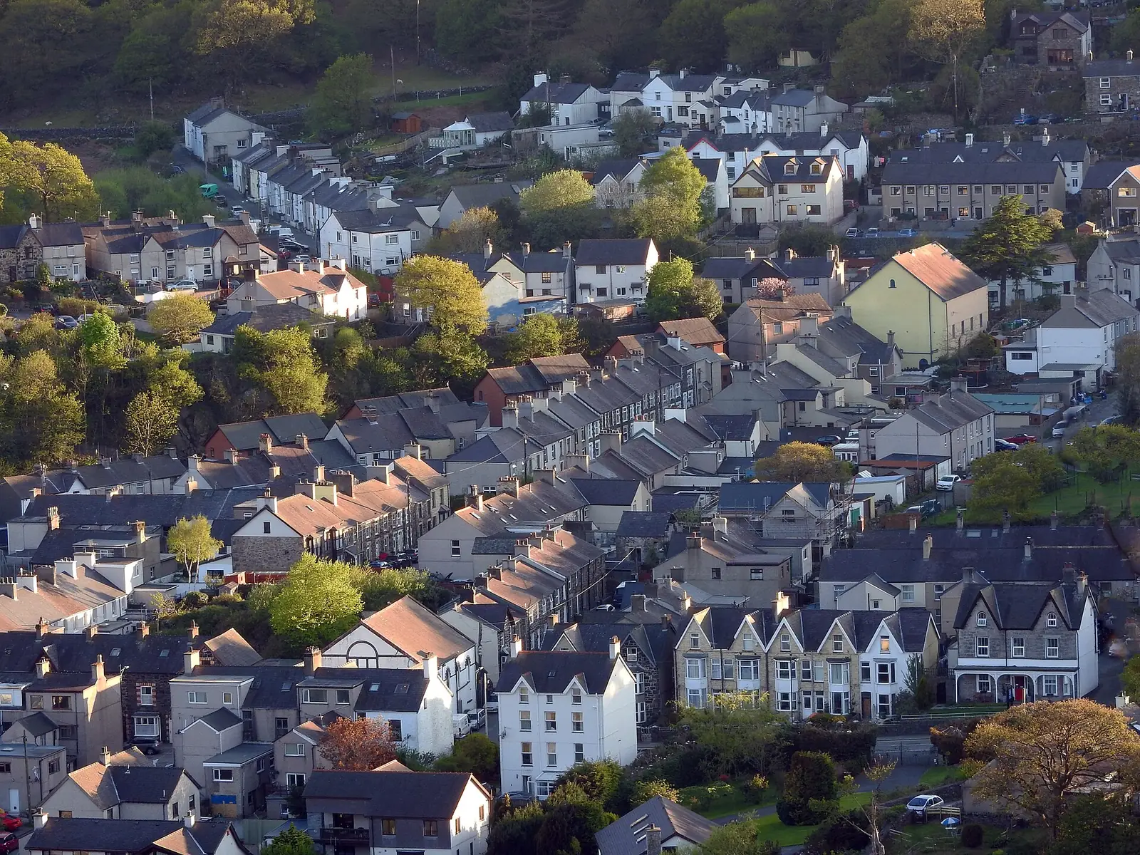 Terraced streets and rooftops of Llanberis seen from above, houses climbing the hillside