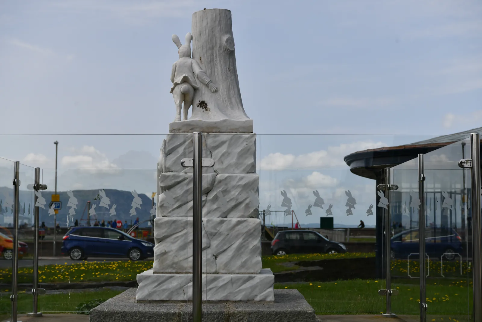 The 1933 White Rabbit Memorial on West Parade, Llandudno, its carved rabbit above the inscribed marble pillar