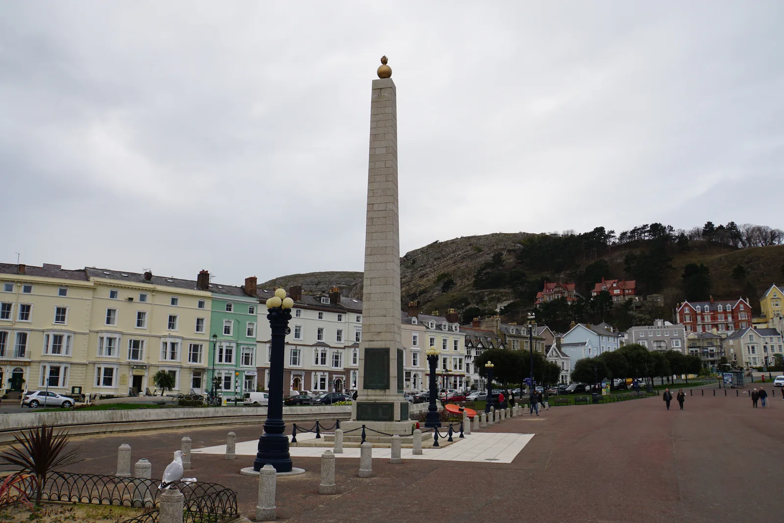 Llandudno's war memorial obelisk on the promenade, Victorian terraces and the Great Orme behind