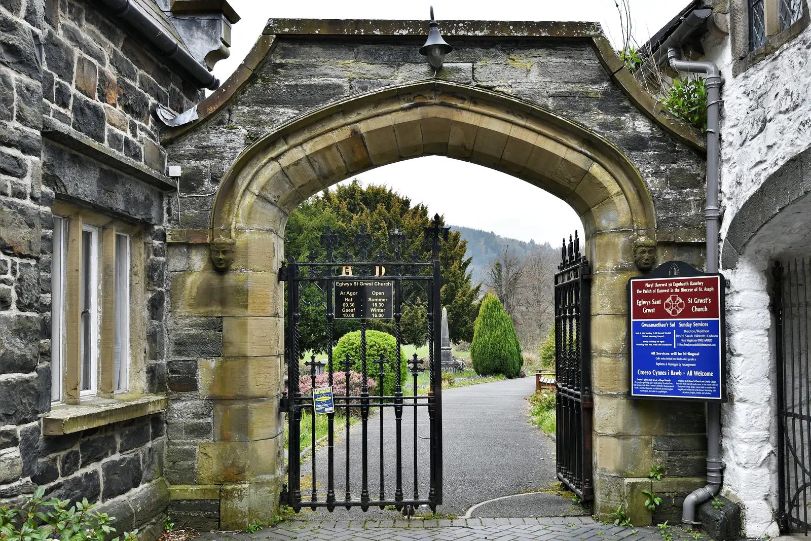 The stone arch on Church Street forming the entrance to St Grwst's churchyard, Llanrwst