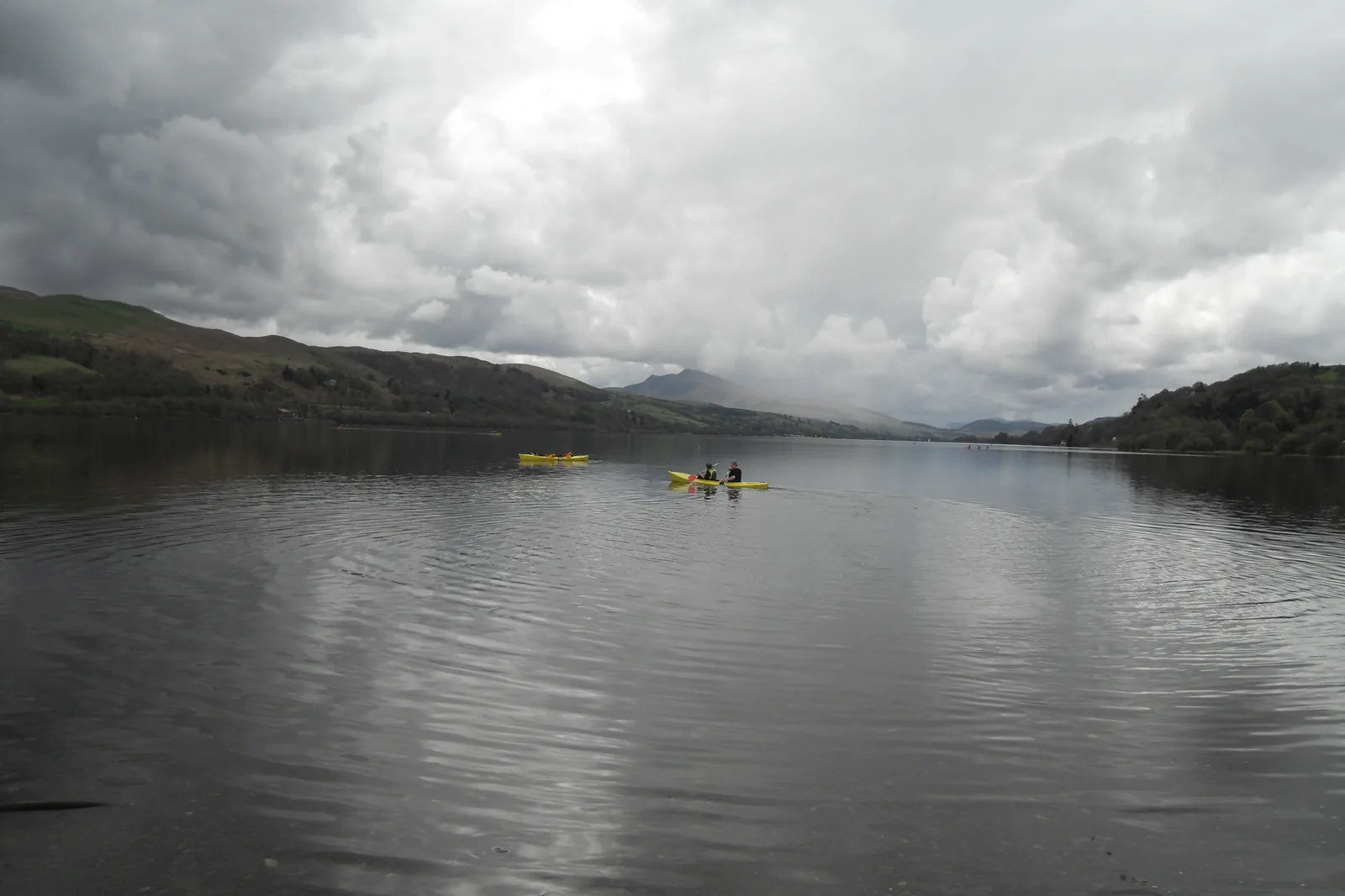 Kayaks on the open water of Llyn Tegid.