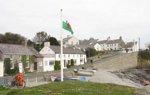 Moelfre harbour, Anglesey, a working harbour with small boats moored below the village.