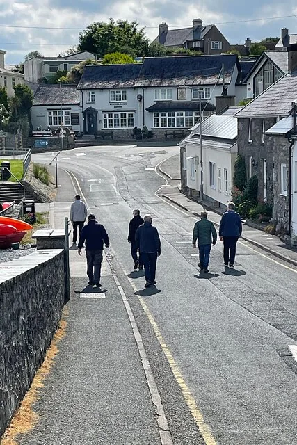 Walkers on a street in Moelfre