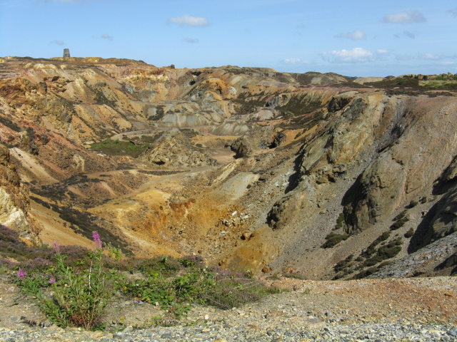 The copper pit at Parys Mountain: exposed mineral workings showing the vivid ochre and rust colours of the ore-bearing rock.