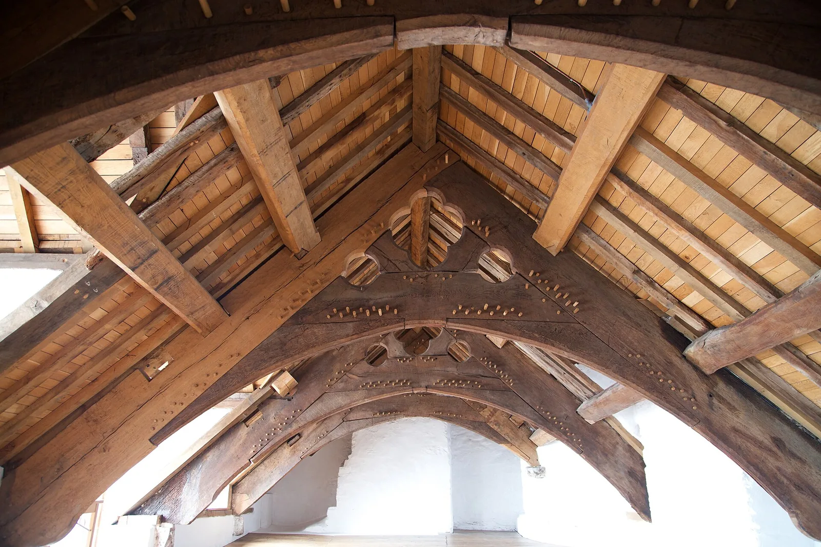 Exposed roof timbers in the attic at Plas Mawr, showing arch-braced collar trusses.
