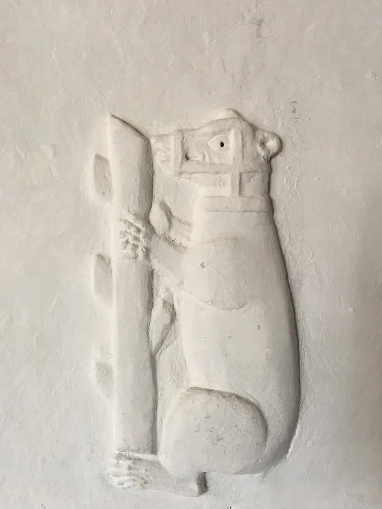 A close plasterwork detail of the bear and ragged staff emblem in the chamber over the brewhouse at Plas Mawr.