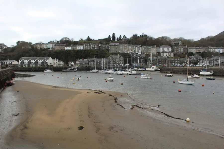Porthmadog harbour, boats moored on the seaward side of the Cob.