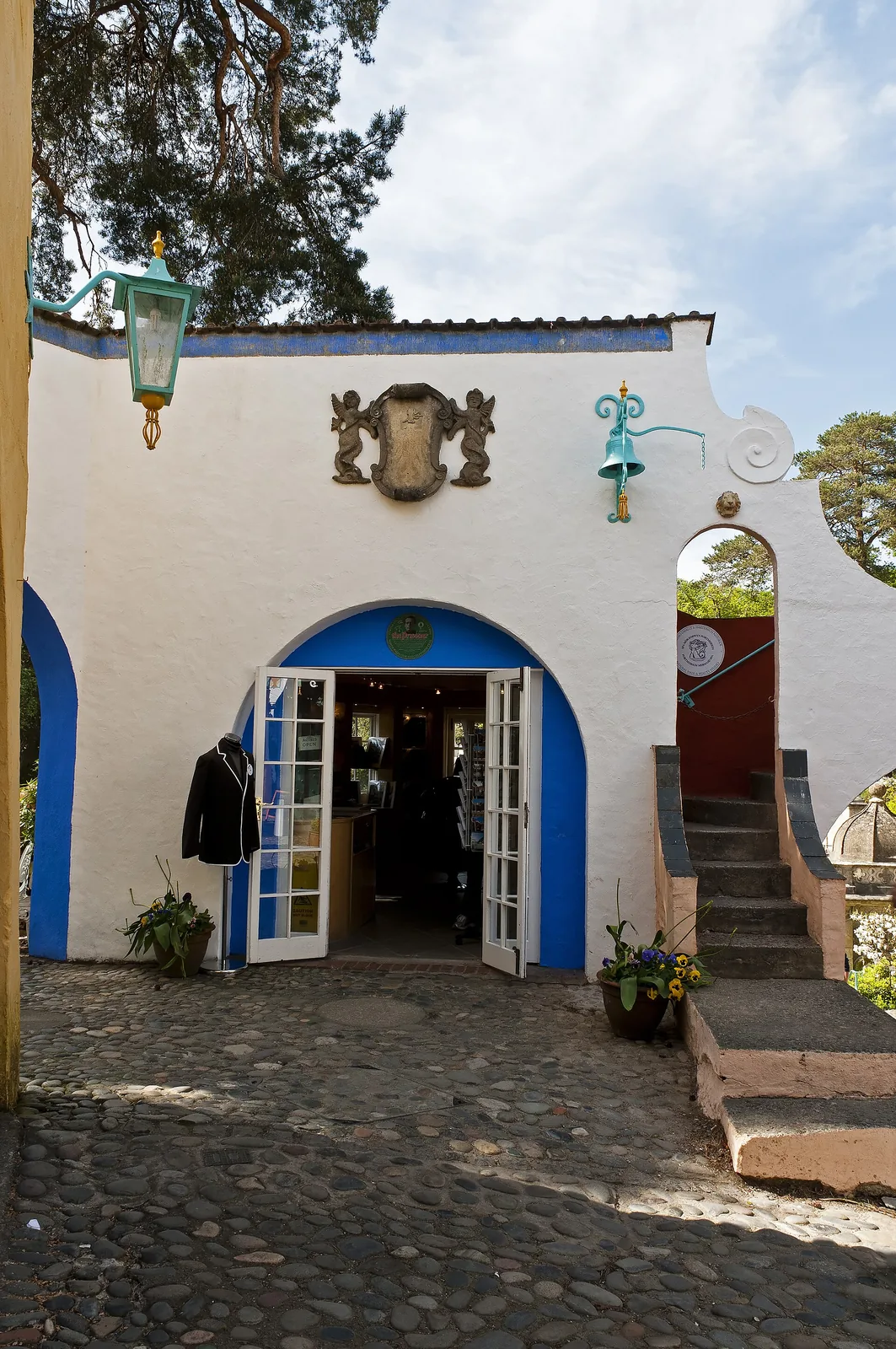A village shop frontage at Portmeirion, with window displays of gifts and souvenirs.