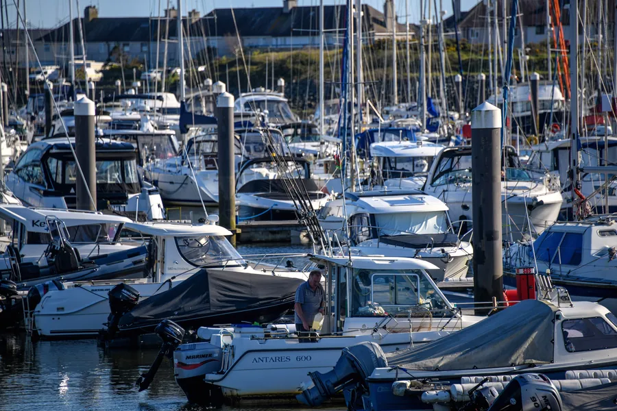 Masts and pontoons at Hafan Pwllheli, the marina where the Afon Erch and the Afon Rhyd-hir meet the sea, Llŷn Peninsula, Gwynedd.