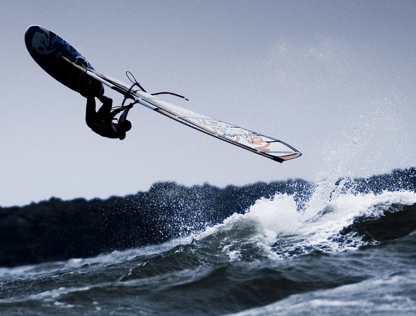 A windsurfer thrown clear of the board off Rhosneigr during the Forces Open Wave Sailing Championships