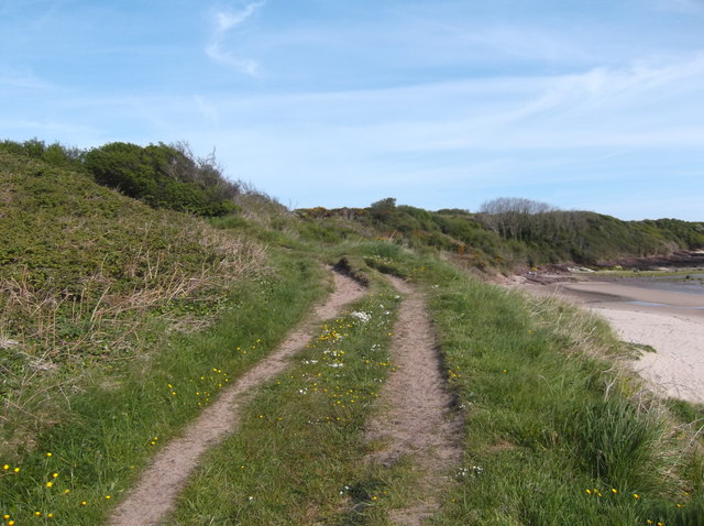 The Anglesey Coast Path running north from Traeth Lligwy along the headland above the sea.