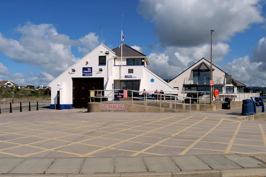 The RNLI lifeboat station building on Trearddur Bay, with its gift shop and slipway.