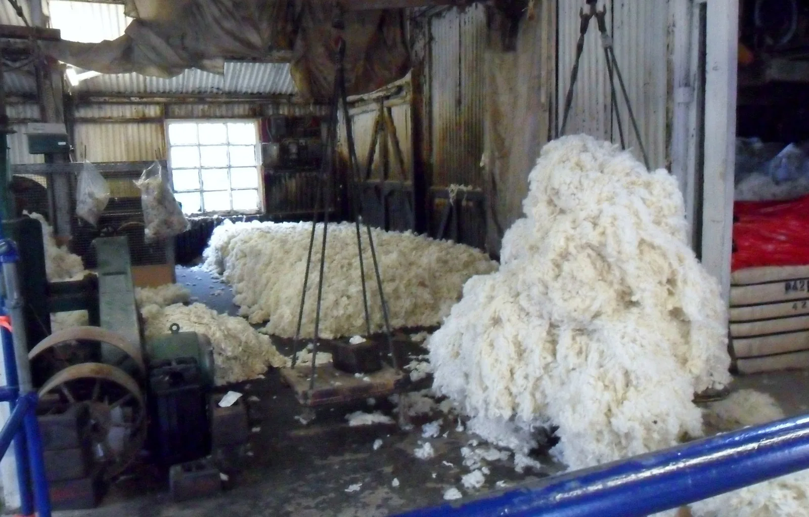 Wool in the mill at Trefriw, spun yarn wound on bobbins