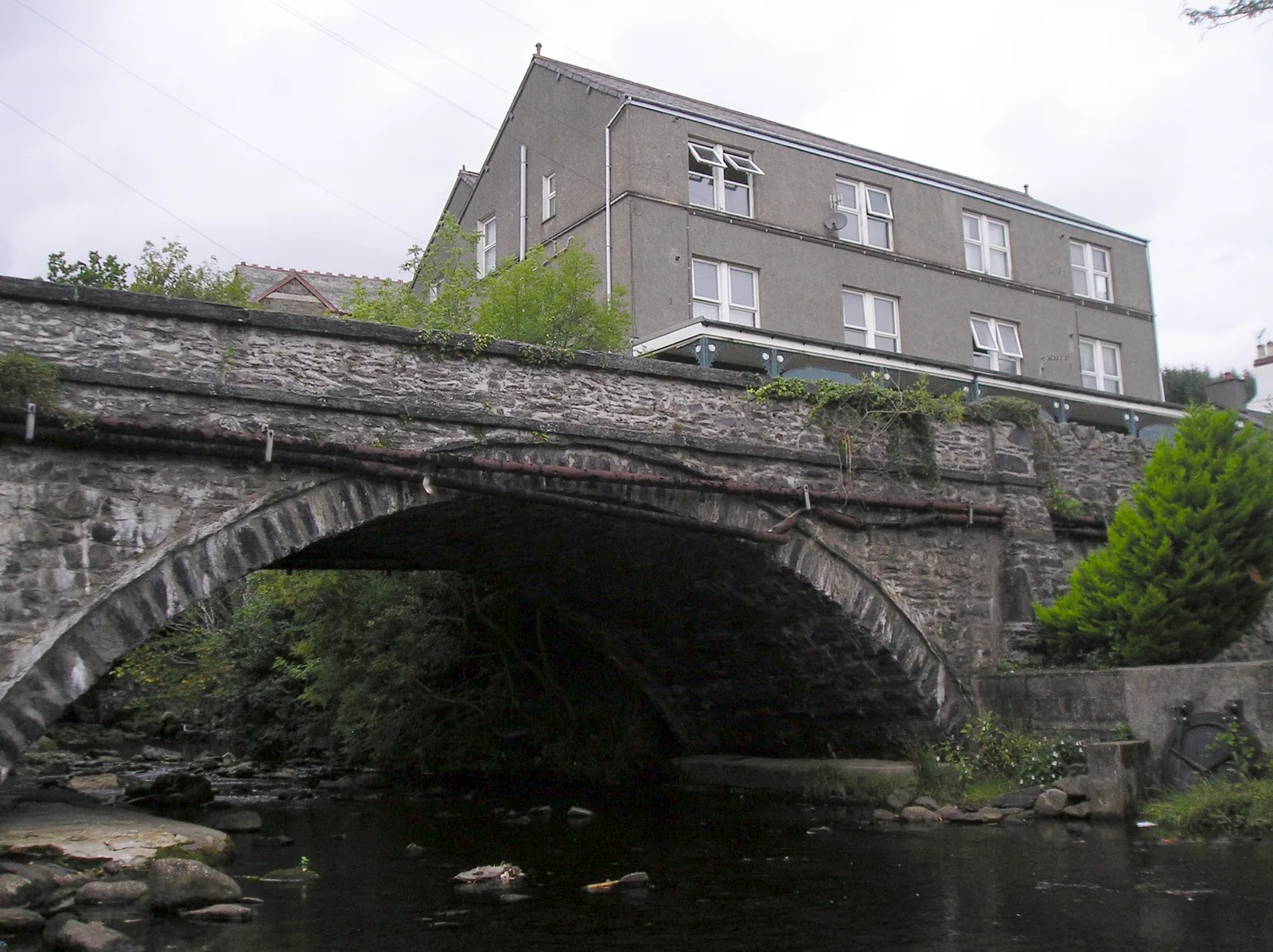 The stone road bridge carrying the main road over the Afon Crafnant in the centre of Trefriw