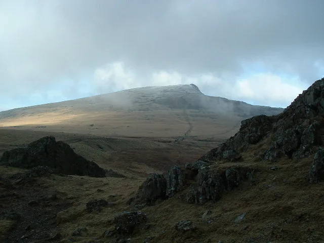 The path up Y Garn, towards the snow-capped summit