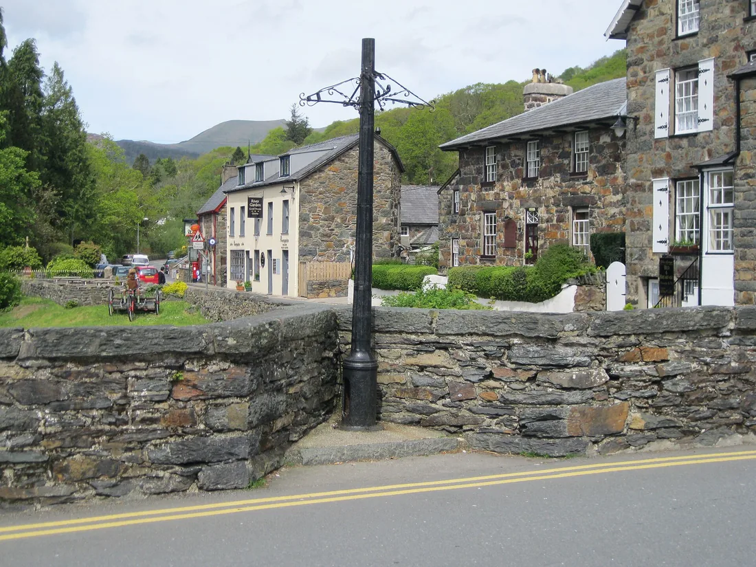 Stone houses and the bridge over the river Glaslyn in the village of Beddgelert