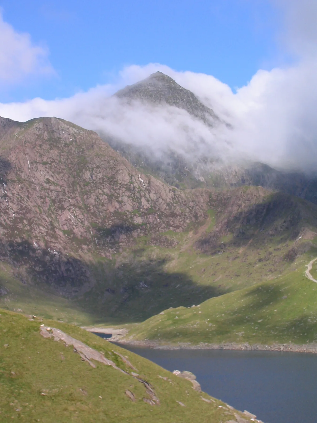 Yr Wyddfa (Snowdon), the highest mountain in Wales, above the lakes of Eryri, Gwynedd.
